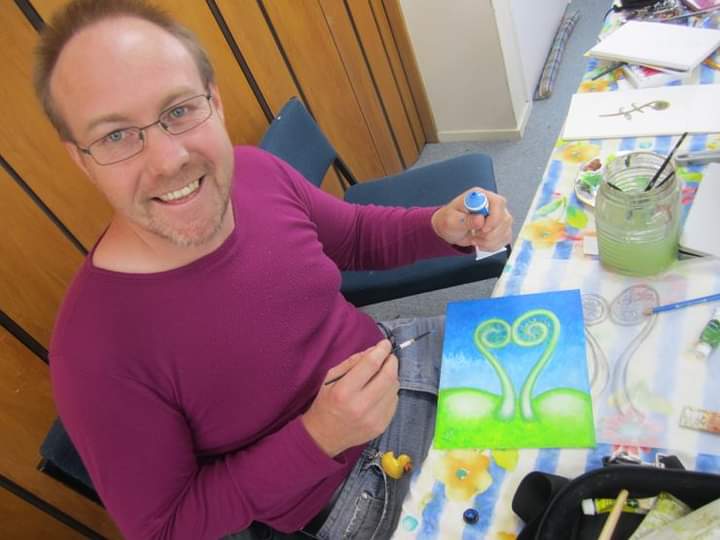 Michael Yewen working on one of his paintings.  