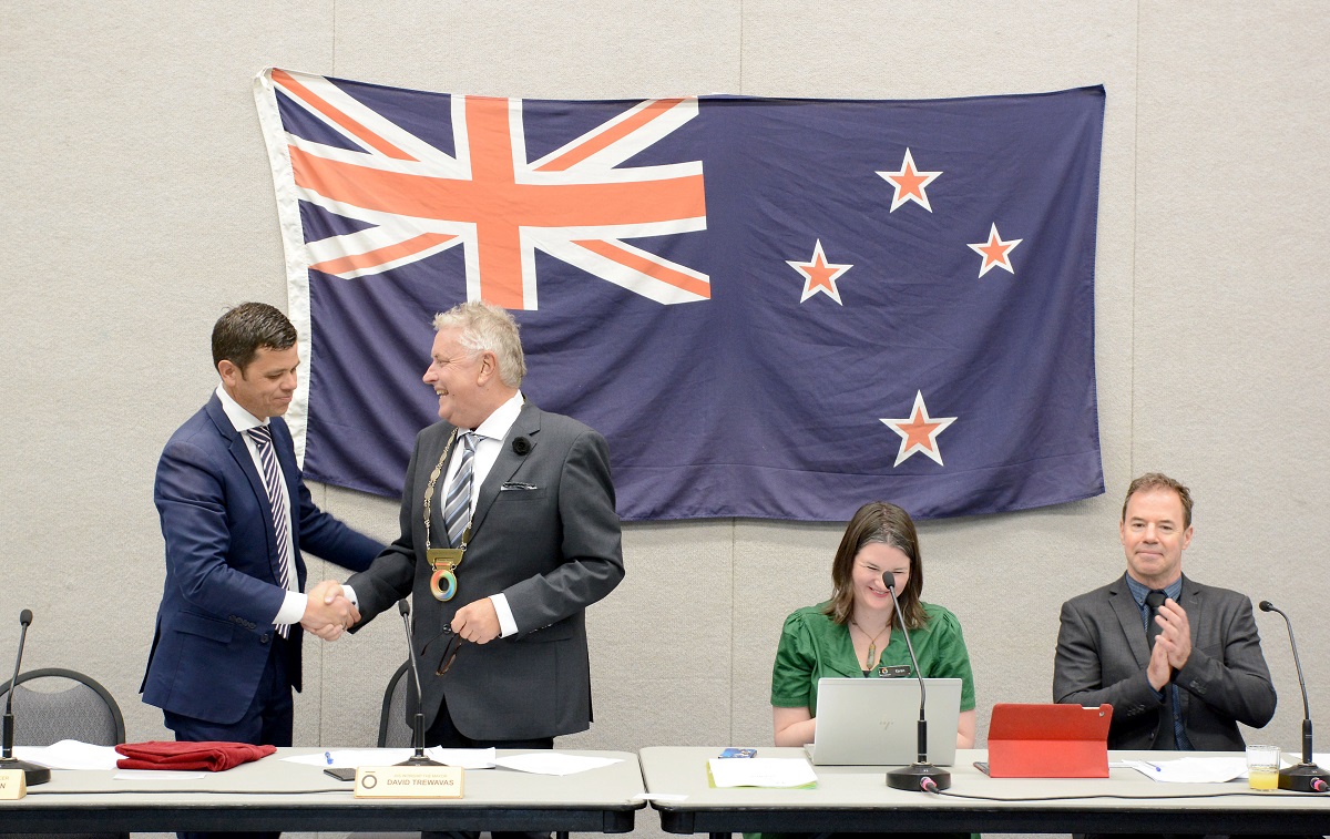 Taupō District Council chief executive Gareth Green congratulates Mayor David Trewavas.  