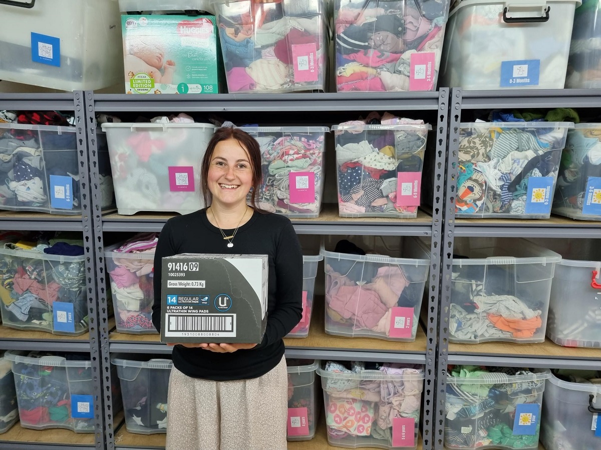 Pregnancy Help Taupō branch coordinator Ellie Godwin with one of the boxes of free period products the organisation received.  