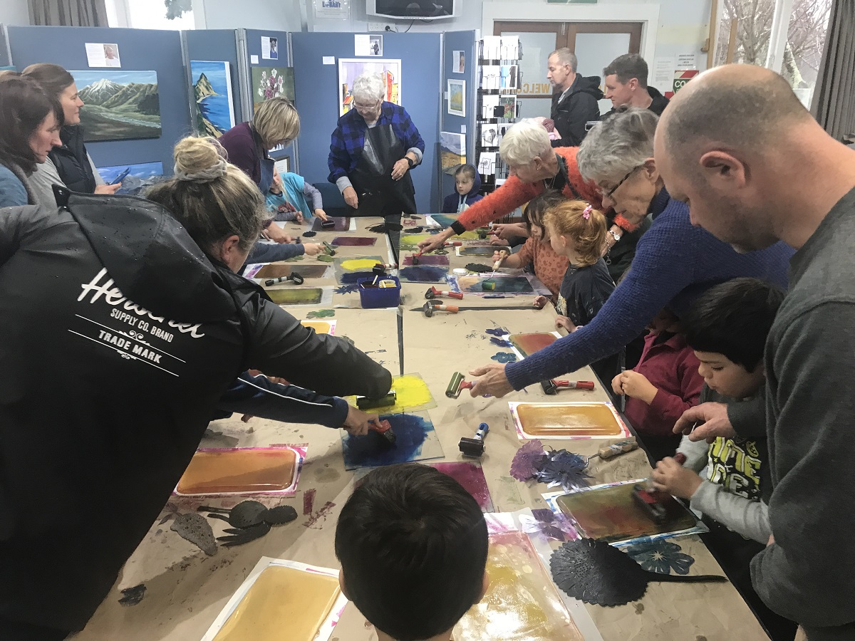 Kids enjoying printmaking workshops at the Taupō Winter Festival.  