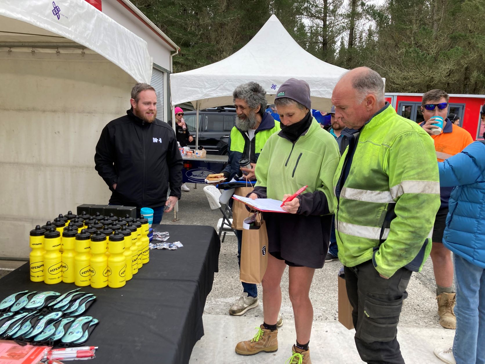 NZI Insurance fleet risk manager Michael Stirk welcomes truck drivers and hands out goodie bags.