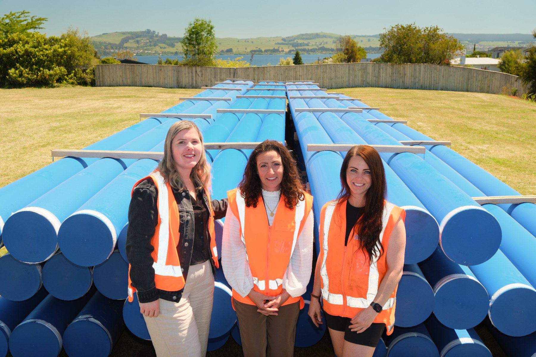 Project manager Nicole Clark, Councilor Rachel Cameron, and Camex site manager Shannan Bell on site with the new water mains.  