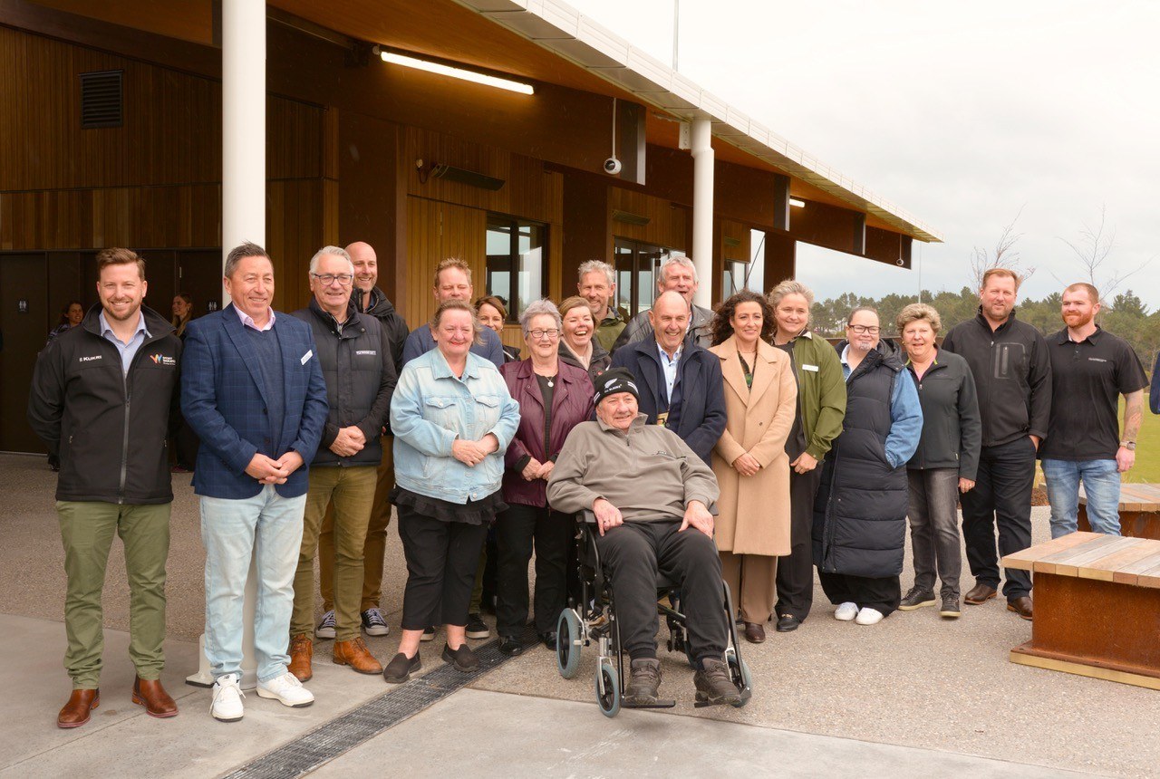 Members of Owen Delany’s family (centre) with Mayor John Funnell, councillors, contractors and council project staff at the opening.  