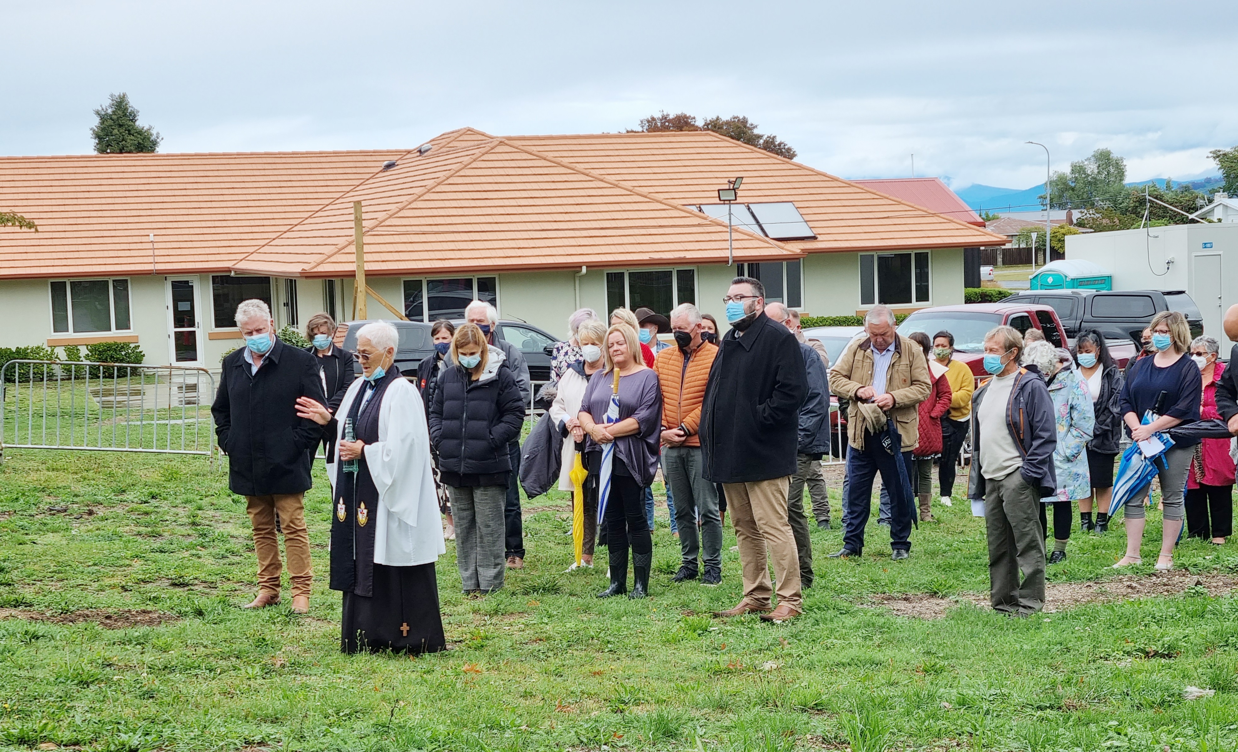 Reverend Peace performing the blessing at the site of the new Waiora House main building.  