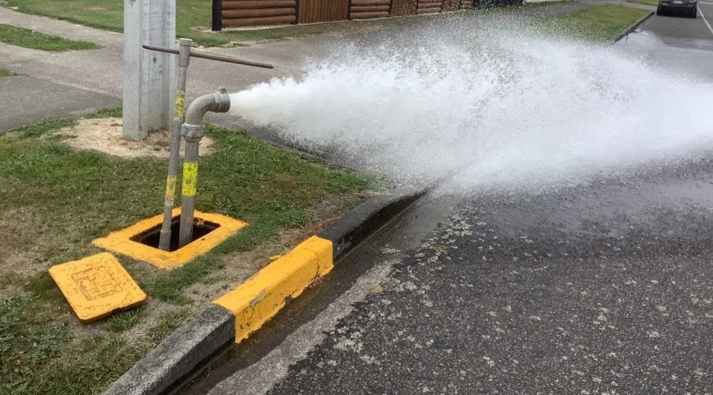 Fire hydrant flushing in progress.  